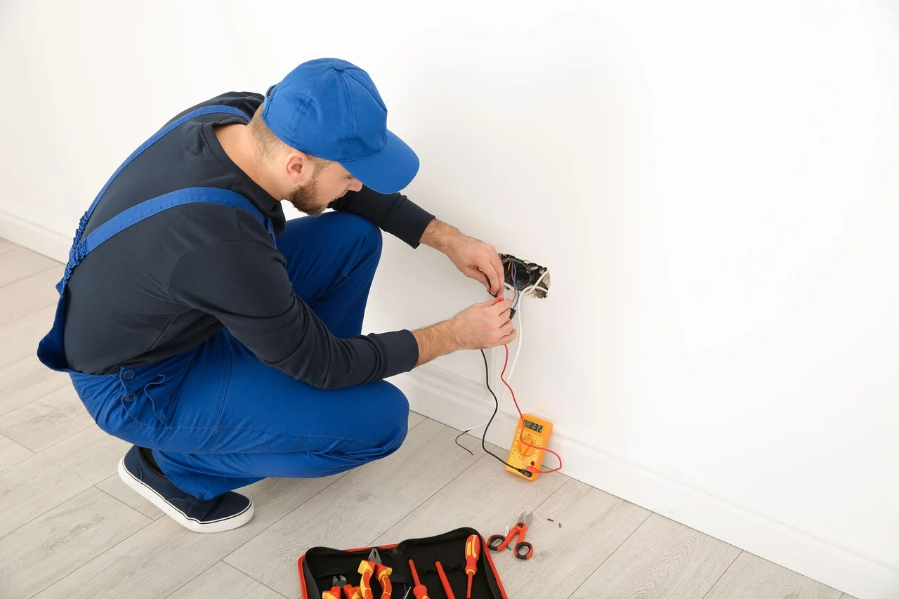 Electrician testing an outlet